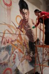 Hung Liu painting on mural